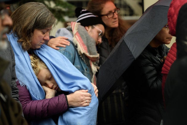 Worshippers listen to Rabbi Chuck Diamond, former Rabbi of the Tree of Life Congregation, as he conducts a Shabbat prayer vigil in front of the Tree of Life Synagogue on Nov. 3, 2018 in Pittsburgh, Pennsylvania.