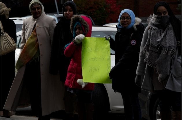 Young members of the Islamic Institute of Toronto offer support at Beth Sholom in York, Ont. on Nov. 3, 2018.