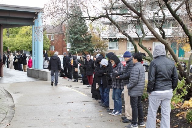 Members of the Islamic Institute of Toronto gather in a "ring of peace" at Beth Sholom in York, Ont. on Nov. 3, 2018.