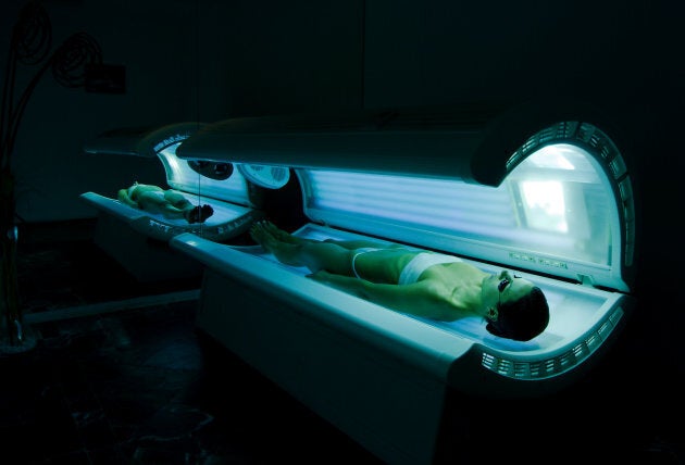 young women tanning in solarium