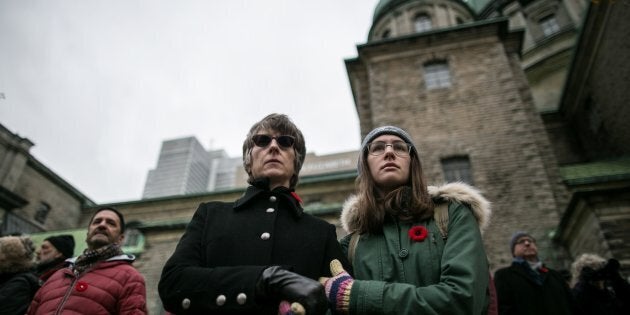 Canadians watch military parades during Remembrance Day ceremonies in Montreal, Quebec.