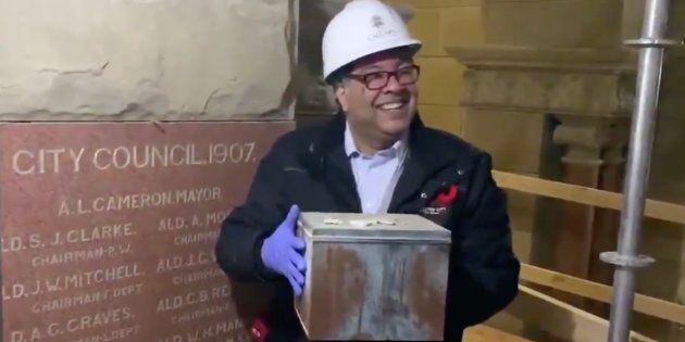 Calgary mayor Naheed Nenshi poses with the 110-year-old time capsule retrieved from City Hall on Nov. 8, 2018