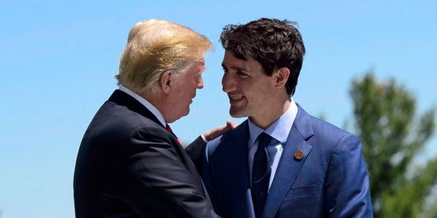 Prime Minister Justin Trudeau greets U.S. President Donald Trump during the official welcoming ceremony at the G7 Leaders Summit in La Malbaie, Que., on June 8, 2018.