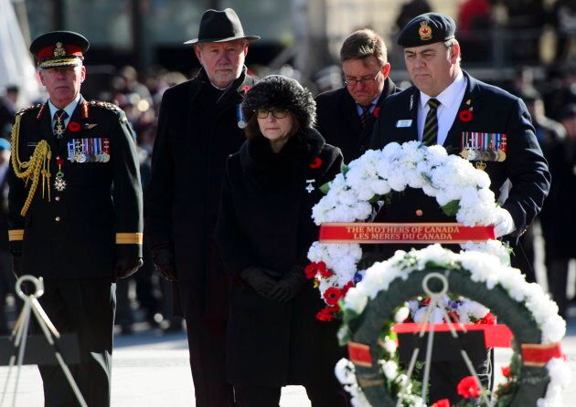 National Silver Cross mother Anita Cenerini prepares to lay down a wreath on Sunday.