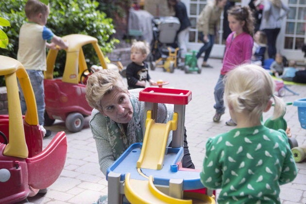 Former Ontario premier Kathleen Wynne visits a daycare in Toronto on May 18, 2018. Her government had budgeted billions of dollars to create free child care for kids, from the age of two-and-a-half until kindergarten.