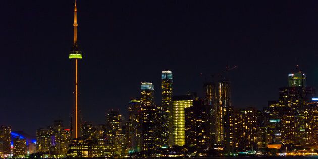 Night view of the Toronto skyline from inside the waters of Lake Ontario. After a violent year, Toronto has the highest homicide rate out of Canada's largest cities.
