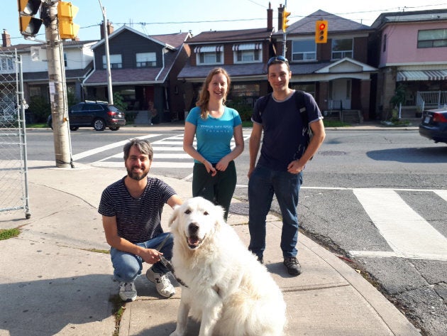 Gilleen Pearce poses with her husband and Walk My Dog Toronto co-founder Colin and Eric, a staff member.