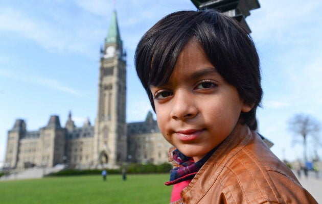 Adam Ahmed, of Markham, Ont., poses for a photo on Parliament Hill in Ottawa on Nov. 8, 2016. Ahmed has been repeatedly flagged at the airport because his name matches one on a security list.