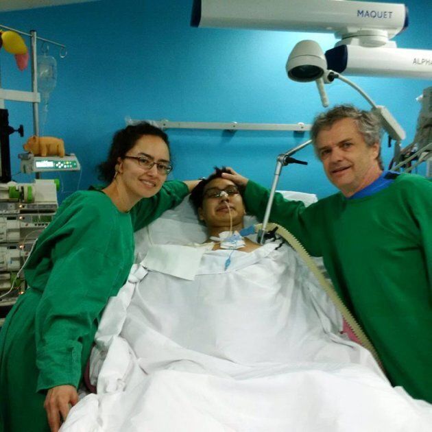 Napu Boychuk, centre, is pictured at a hospital in Cuba with his sister Tutalik and father Dan.
