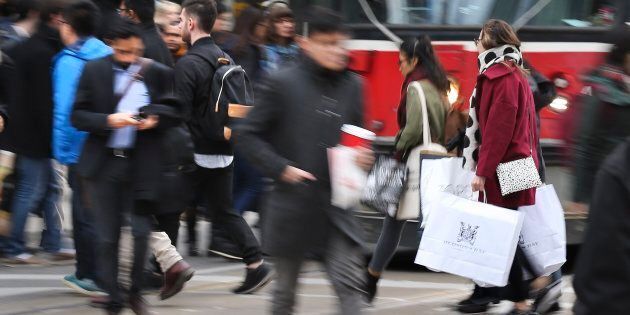 Shoppers outside Toronto's Eaton Centre on Black Friday, Nov. 27, 2015. A new survey of Canadians' financial situations shows a great number will likely take on debt to fund the holiday season, even at a risk to their own mental well-being.