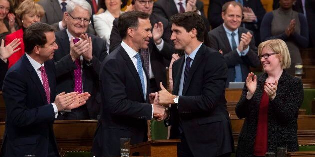 Prime Minister Justin Trudeau shakes hands with the Finance Minister Bill Morneau following the fiscal economic update in the House of Commons on Nov. 21, 2018.