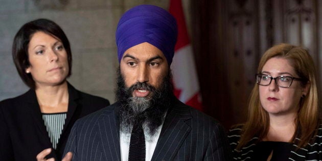 NDP leader Jagmeet Singh and MPs Karine Trudel, left, and Tracey Ramsey speak to reporters in the foyer of the House of Commons on Oct. 1, 2018.