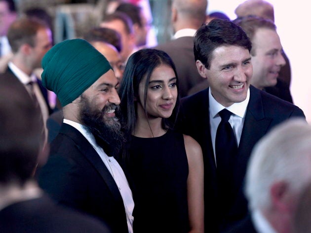 Prime Minister Justin Trudeau poses for a photo with NDP Leader Jagmeet Singh and his wife Gurkiran Singh at the Parliamentary Press Gallery Dinner in Gatineau, Que., on May 26, 2018.