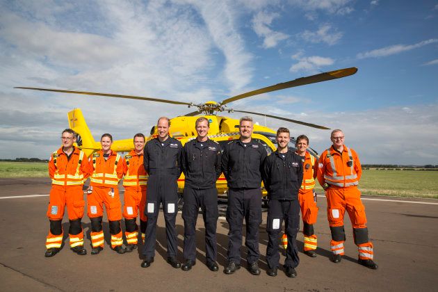 Prince William poses with the East Anglian Air Ambulance on July 27, 2017 near Cambridge, England.