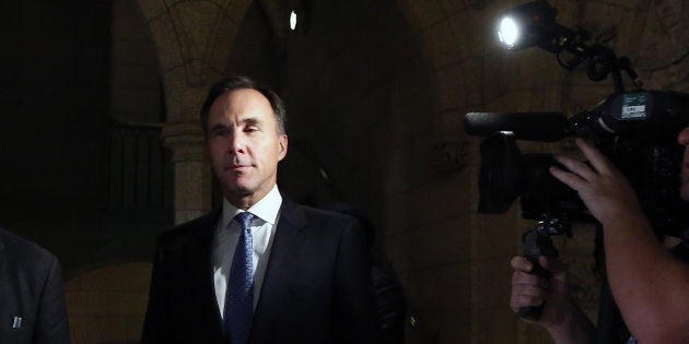 Finance Minister Bill Morneau arrives in the foyer after tabling the Fall Economic Statement at the House of Commons on Nov. 21, 2018.