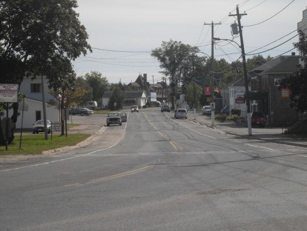 Saunders Road in McAdam, N.B. is shown, with the McAdam railway station in the background.