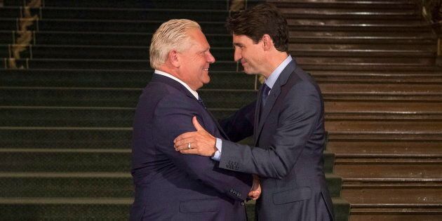 Ontario Premier Doug Ford greets Prime Minister Justin Trudeau at the Ontario Legislature in Toronto on July 5, 2018.