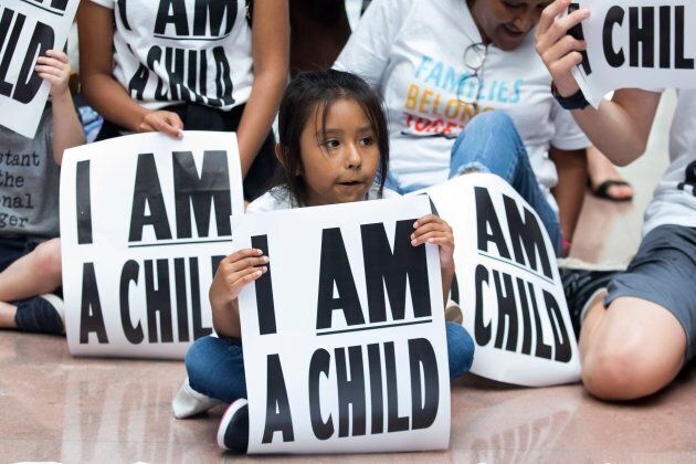 Children and families stage a sit-in on Capitol Hill in Washington, D.C. on July 26, 2018. Protesters demanded the Trump administration reunify migrant families separated at the southern border.