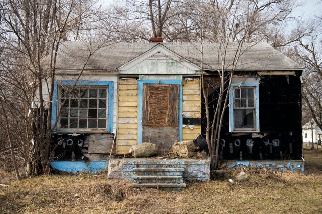 An abandoned house sits in a neighbourhood north of downtown Flint, Mich.