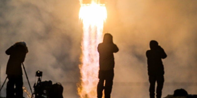 A rocket booster carrying the Soyuz MS-11 spacecraft with Russian cosmonaut Oleg Kononenko, NASA astronaut Anne McClain, and Canadian astronaut David Saint-Jacques aboard lifts off to the International Space Station on Dec. 3, 2018.