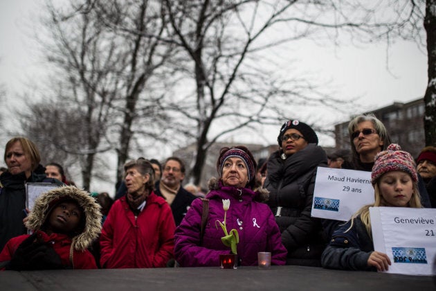 People take part in a ceremony to mark the anniversary of the Polytechnique massacre in Montreal on Dec. 6, 2014.