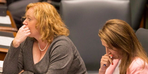 Ontario ministers Lisa MacLeod and Caroline Mulroney sit at Queen's Park in Toronto on Sept. 12, 2018. The auditor general says that Legal Aid Ontario spends $20 million a year appealing the decisions of the Ontario Disability Support Program (ODSP).