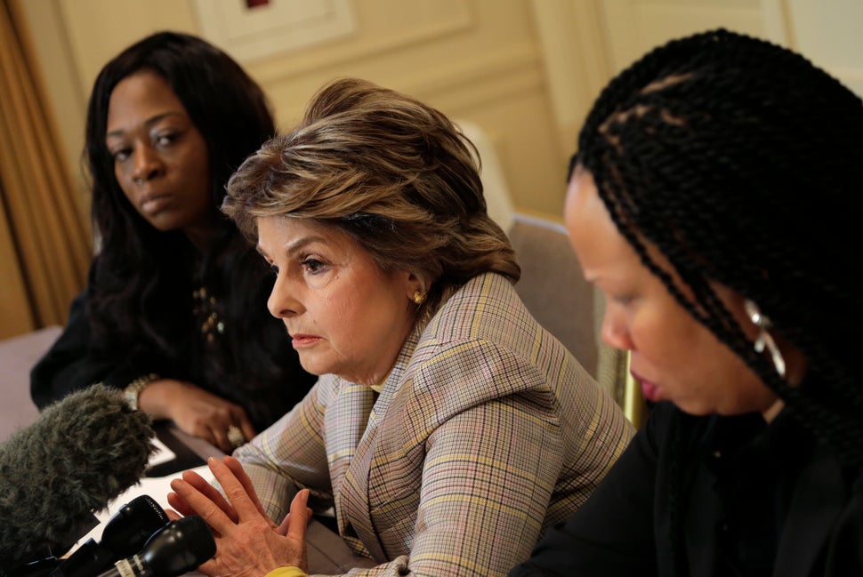 Attorney Gloria Allred, center, speaks while Latresa Scaff, right, and Rochelle Washington look on during a news conference. Scaff and Washington accused musician R. Kelly of sexual misconduct on the night they attended his concert while they were teenagers. 