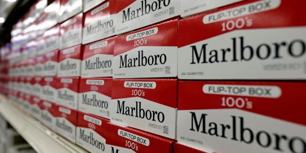This June 14, 2018, file photo shows cartons of Marlboro cigarettes on the shelves at JR outlet in Burlington, N.C.