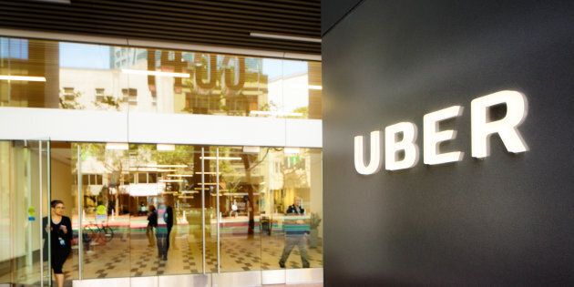 Uber headquarters entrance in San Francisco with sign on the right.