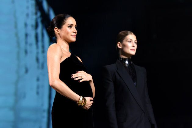 Meghan Markle and actress Rosamund Pike on stage during The Fashion Awards 2018 at Royal Albert Hall on Dec. 10, 2018 in London, England.