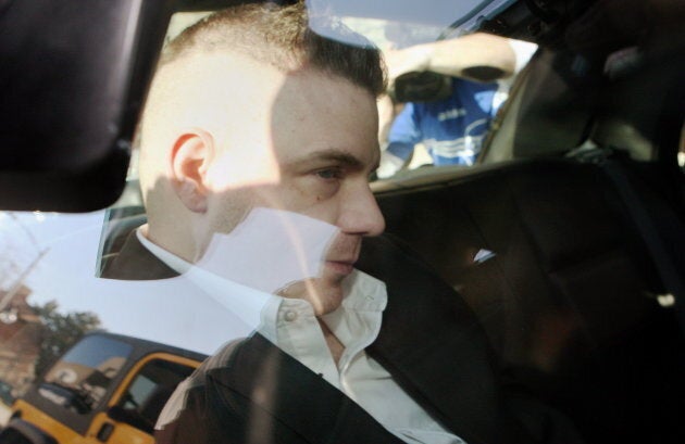 Michael Rafferty is transported in the back of police cruiser in London, Ont. on March, 14, 2012.