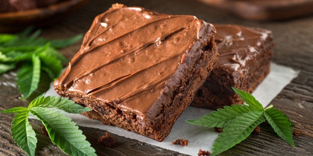 Homemade pot brownies with marijuana leaf garnish.