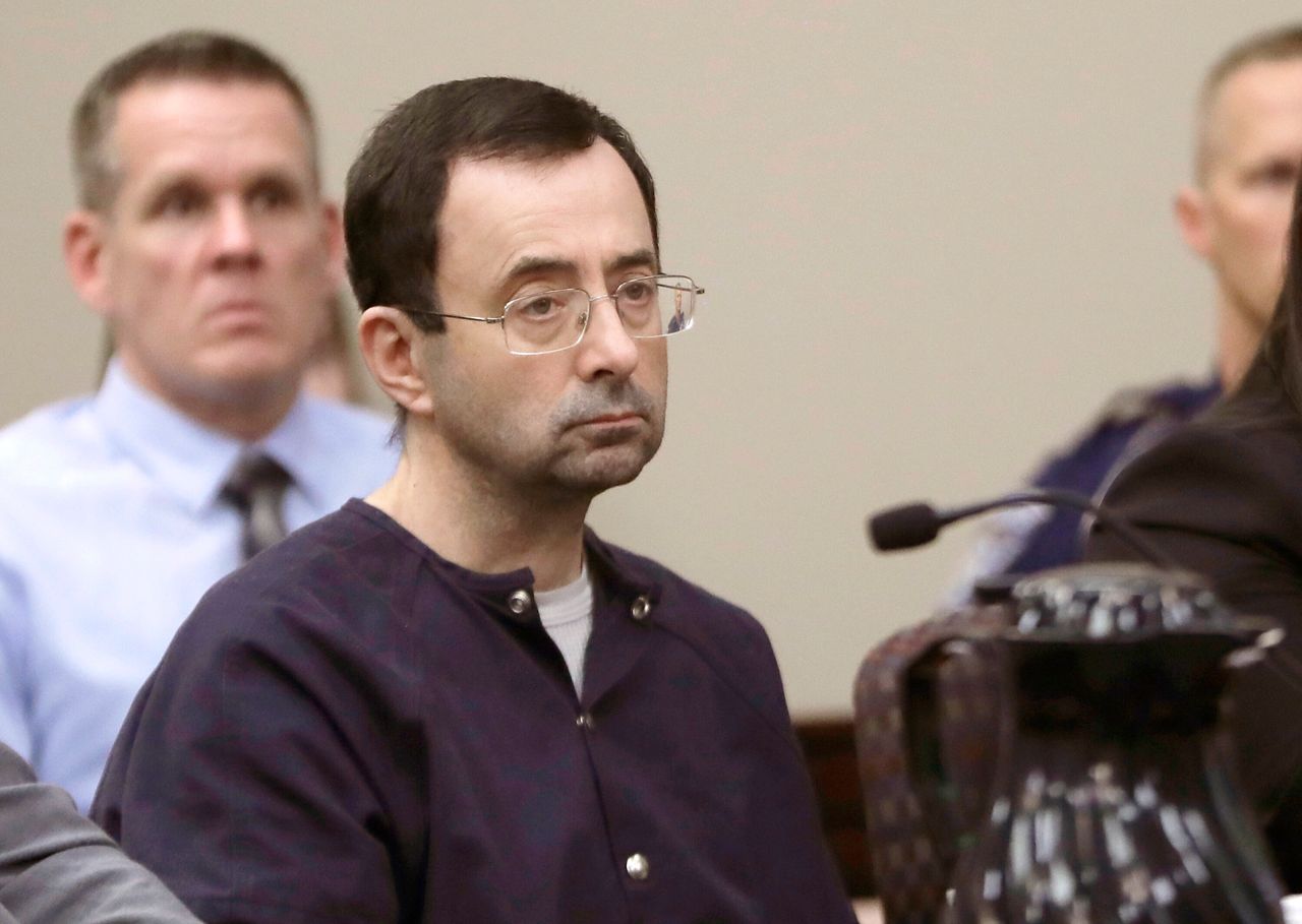 Larry Nassar, a former doctor for USA Gymnastics and member of Michigan State's sports medicine staff, sits in court during his sentencing hearing in Lansing, Mich., Michigan State University said Thursday, Aug. 30, 2018.
