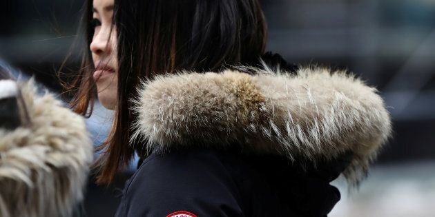 A woman wears a Canada Goose jacket in Times Square, New York, March 16, 2017. Canada Goose shares have tanked in recent days, amid talk of a boycott in China brought about by the arrest of Huawei's chief financial officer in Vancouver.
