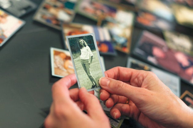 Crystal Deckard looks over an old photograph of her mother Darlene Coker as she reminisces over her mother's life in California on Aug. 15, 2018.