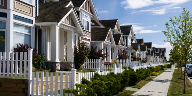 A row of townhouses in Richmond, B.C. Up to 71 percent of Canadians believe that the federal government should be doing more to curb runaway home values.