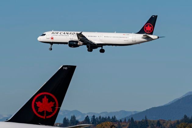 An Air Canada jetliner landing at Vancouver International Airport in Richmond, B.C. on Oct. 16, 2018.