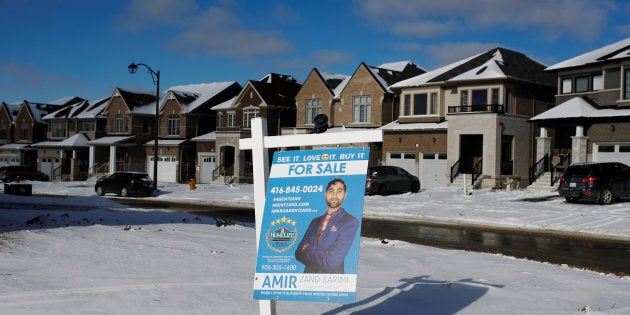 A house for sale in East Gwillimbury, Ont., Jan. 30. 2018. A new report from CIBC says the correction in Canada's housing market is not over yet — though it might finally come to an end next year.