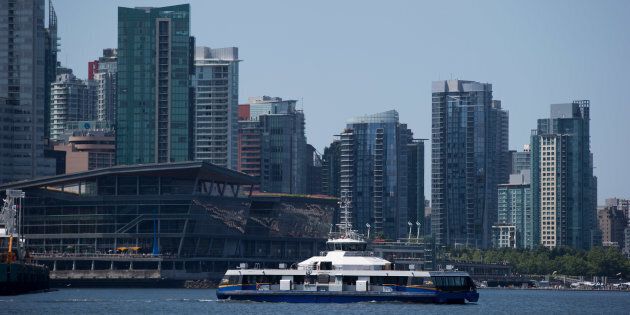 A Seabus commuter vessel with condo towers in the background, Vancouver, B.C., Tues. July 11, 2017. Vancouver's housing market has entered a
