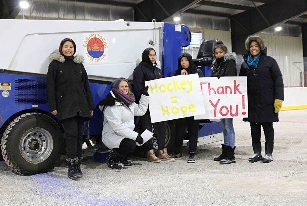 The Rez Girls share thank you signs with their GoFundMe supporters.