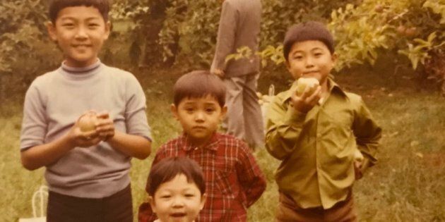 Saewan Koh, on the far right, with his three brothers apple picking in Mississauga, Ont.