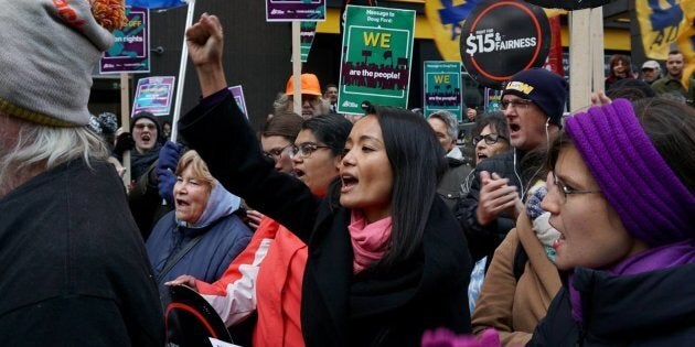 Ontario MPP for Parkdale-High Park Bhutila Karpoche marches in a minimum wage demonstration.