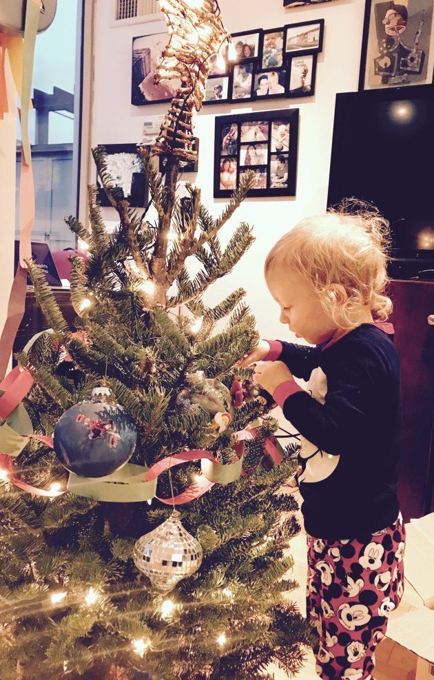 3 year old Phoenix decorates our little tree