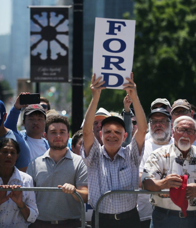 Supporters watch as Doug Ford performs a ceremonial swearing in at Queen's Park in Toronto on June 29, 2018.