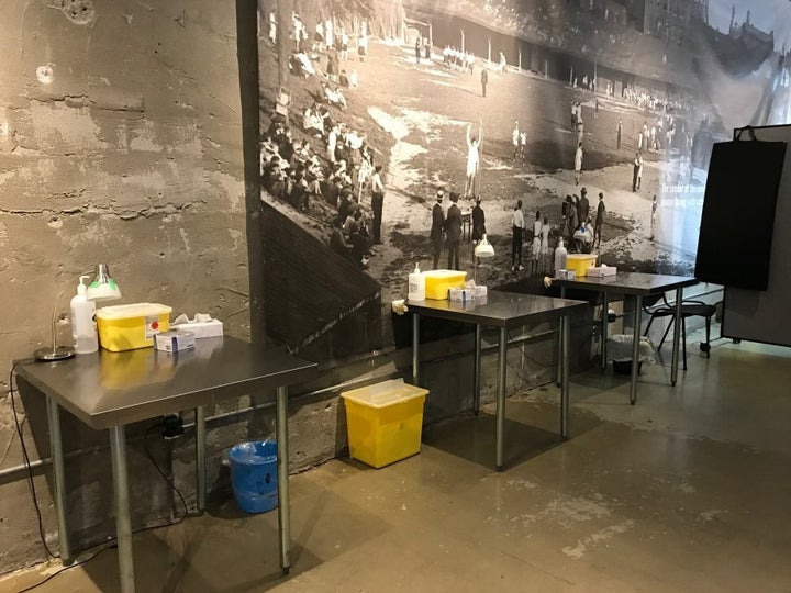Injection stations are equipped with clean supplies, and oxygen and naloxone are kept on hand. At least two overdose prevention supervisors must be in the area at all times.
