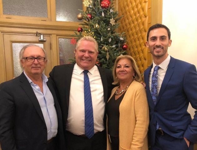 Ontario MPP Stephen Lecce and his parents pose with Premier Doug Ford at Queen's Park.