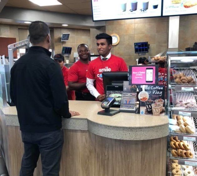 Ontario MPP Vijay Thanigasalam takes orders at a Tim Horton's. The politician worked at the coffee chain when he was a student.