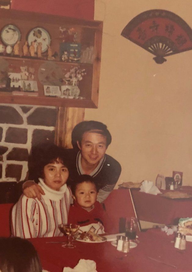 Michael Pan and his parents pose in the Montreal restaurant his father worked in around Christmas 1984. From left to right: Hui Ju, Guo Qiang, Michael Pan.