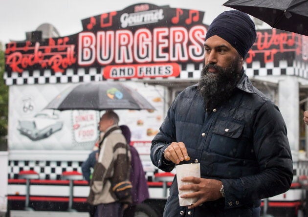 NDP Leader Jagmeet Singh eats popcorn during a visit to the Rumble on Gray Street Fair, in Burnaby, B.C. on Sept. 15, 2018.