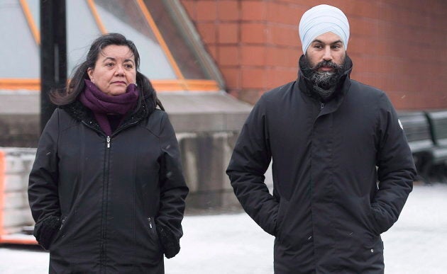 NDP Leader Jagmeet Singh and NDP candidate for the Quebec riding of Outremont Julia Sanchez cross a street during a tour of the Montreal borough on Dec. 22, 2018.